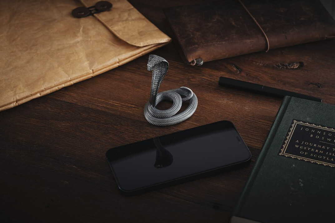 Old detective notebook, magnifying glass and map on a wooden desk