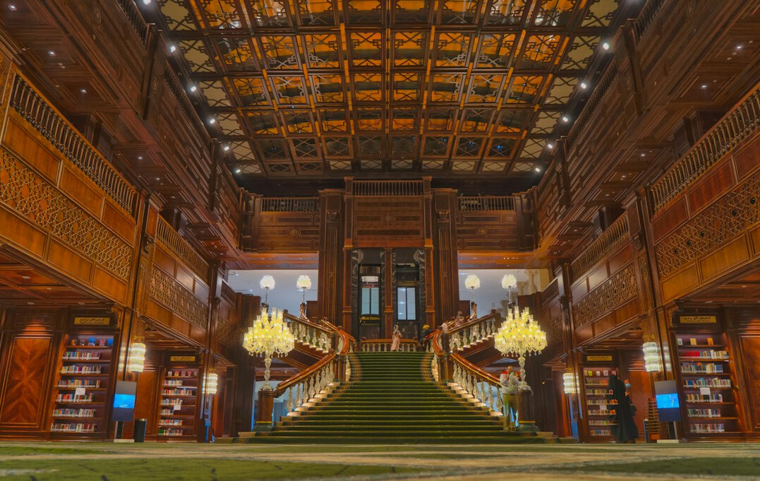 Old library interior with tall wooden bookshelves